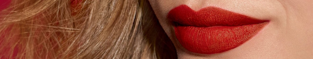 Maybelline Lip Makeup products illustrative banner image - Close up of a blond woman's red lips